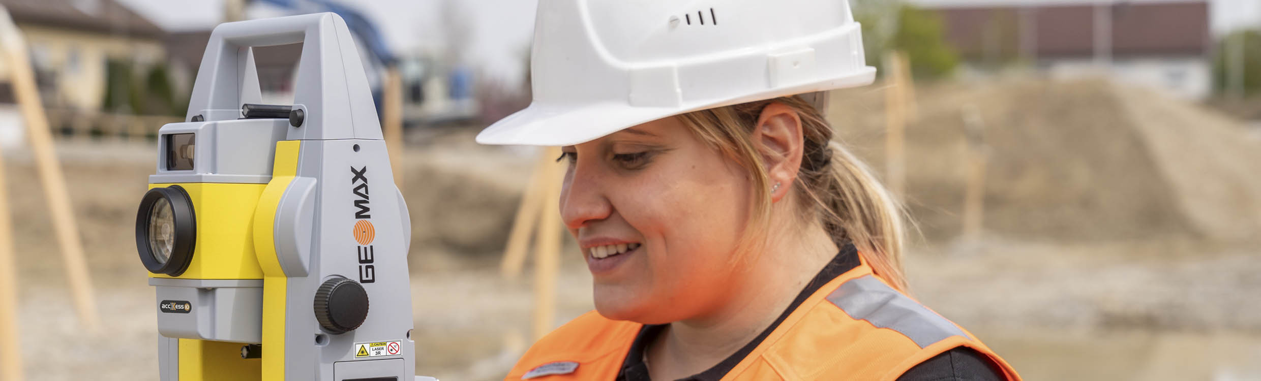 woman working with a geomax total station